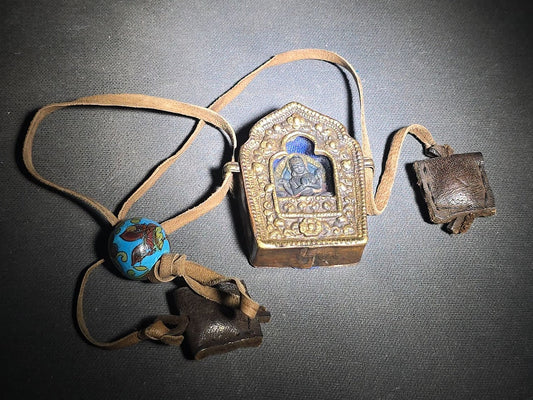 Vintage Copper Tibetan Ghau Prayer Box with Repousse Deity Figure, Cloisonne Enamel Bead, and Leather Cord with Two Small Leather Pouches