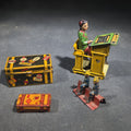 Lot 135 - Grouping of Four Antique and Vintage Tin Lithograph Miniature Toys Including Student at Desk, Two Miniature Travel Suitcases with Hotel and Travel Labels, and Pair of Seated Figures in Helmets