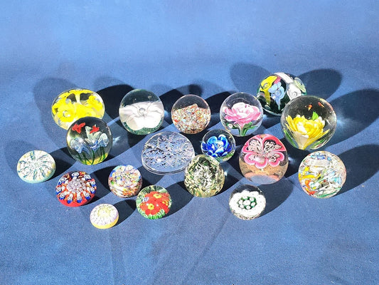 Grouping of 18 Vintage Glass Paperweights including Millefiori, Floral, and Scramble Designs