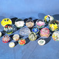 Lot 136 - Grouping of 18 Vintage Glass Paperweights Including Millefiori, Floral, and Scramble Designs
