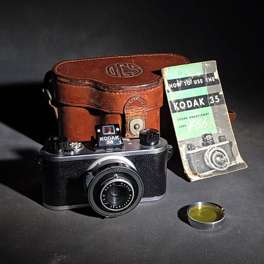 Vintage Kodak 35mm Camera with 50mm Anastigmat f/5.6 Lens, Leather Case, Instruction Booklet, and Yellow Lens Filter