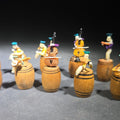 Lot 137 - Grouping of 11 Vintage Miniature Hand-Painted Musician Figures Seated on Turned Wooden Barrels, Made in Japan, in Ys-By Wise-Buy Plastic Case