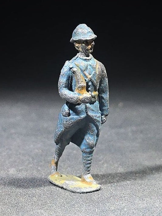 Antique Painted Metal Toy Soldier Figure of a French WWI Infantry Soldier in Horizon Blue Uniform with Adrian Helmet, Marching Pose