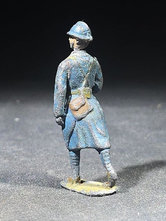 Antique Painted Metal Toy Soldier Figure of a French WWI Infantry Soldier in Horizon Blue Uniform with Adrian Helmet, Marching Pose
