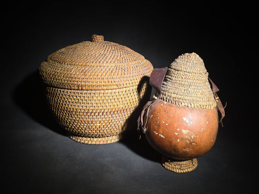 Pair of Vintage Woven Baskets including a Gourd Vessel with Leather Strap and Woven Stopper and a Coiled Lidded Basket