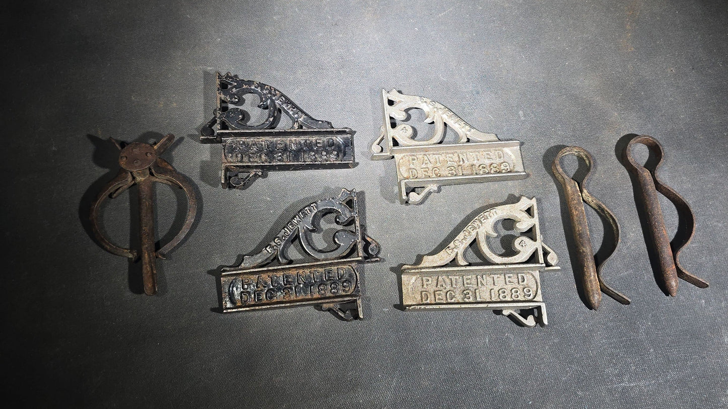 Grouping of Seven Antique Iron Hardware Pieces including Four R.S. Jewett Ornate Shelf Brackets Patented December 31, 1889, a Swivel Ring, and Two Cotter Pins