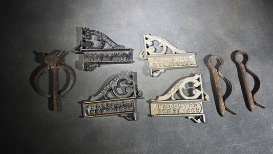 Grouping of Seven Antique Iron Hardware Pieces including Four R.S. Jewett Ornate Shelf Brackets Patented December 31, 1889, a Swivel Ring, and Two Cotter Pins
