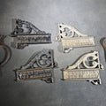Lot 139 - Grouping of Seven Antique Iron Hardware Pieces Including Four R.S. Jewett Ornate Shelf Brackets Patented December 31, 1889, a Swivel Ring, and Two Cotter Pins