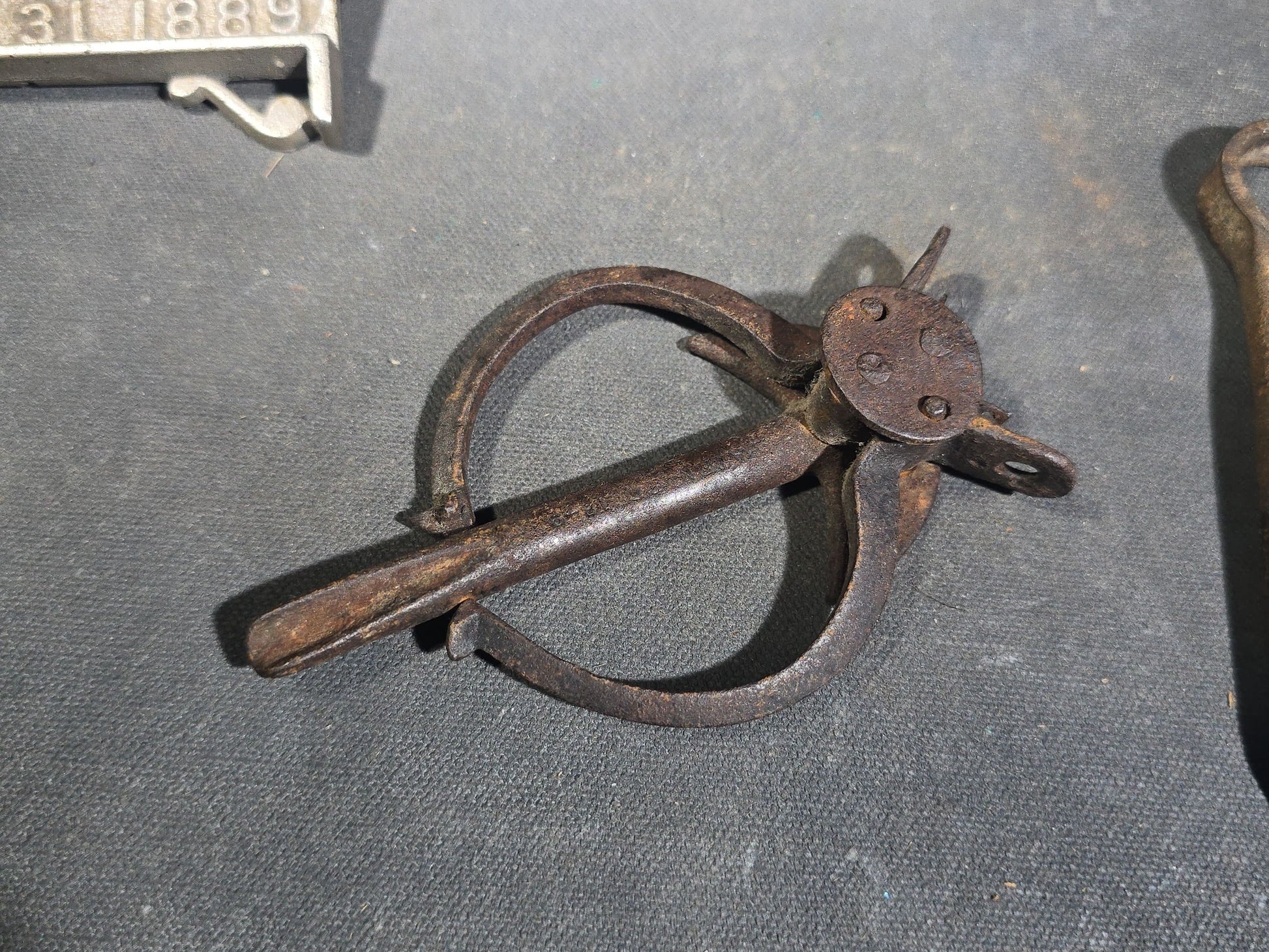 Grouping of Seven Antique Iron Hardware Pieces including Four R.S. Jewett Ornate Shelf Brackets Patented December 31, 1889, a Swivel Ring, and Two Cotter Pins