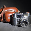 Lot 167 - Vintage Voigtlander Vito Automatic 35mm Camera with Color-Skopar 2.8/50 Lens, Prontor-Matic Shutter, and Leather Case, Note Two Screws Missing from Top Cover, for Parts or Repair