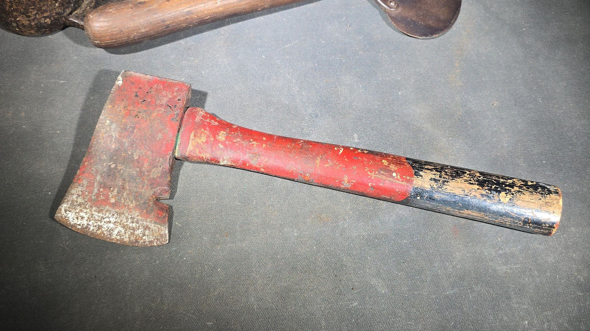 Trio of Antique and Vintage Iron Hand Tools including a Hoe Head, Round Knife with Wood Handle, and Hatchet