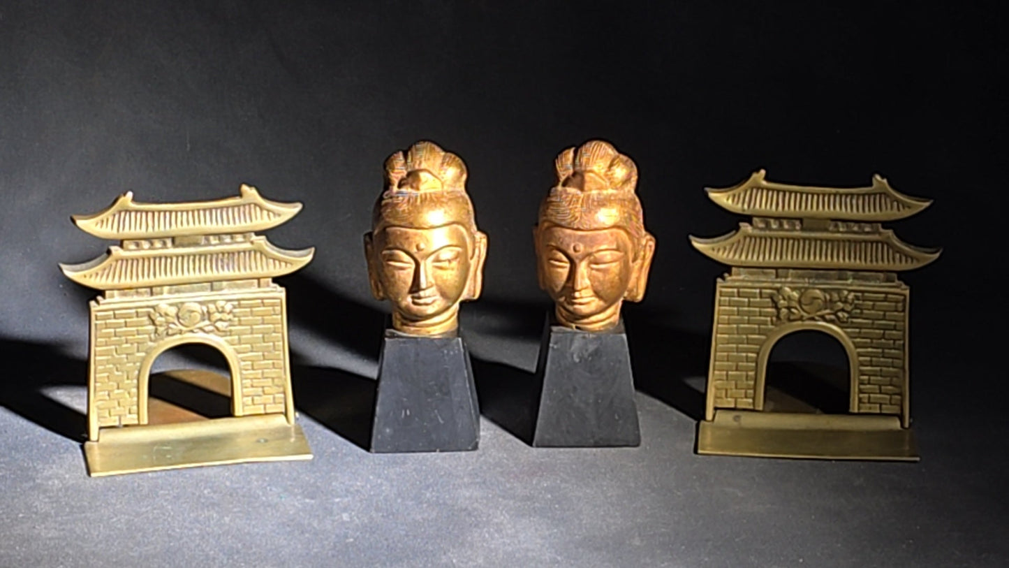 Grouping of Four Vintage Brass Pieces including Pair of Gilt Bodhisattva Head Busts on Stands and Pair of Korean Folding Bookends with Pagoda Gate Design