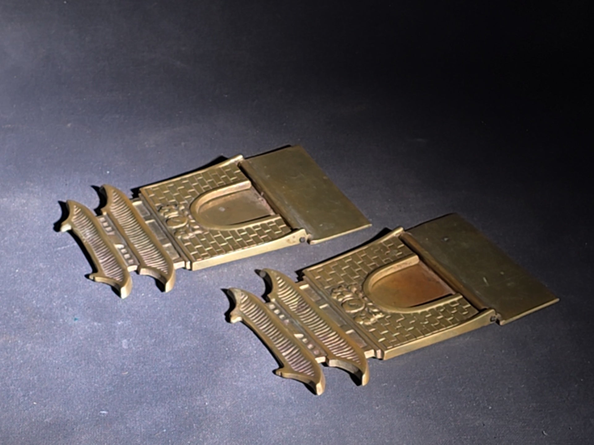 Grouping of Four Vintage Brass Pieces including Pair of Gilt Bodhisattva Head Busts on Stands and Pair of Korean Folding Bookends with Pagoda Gate Design