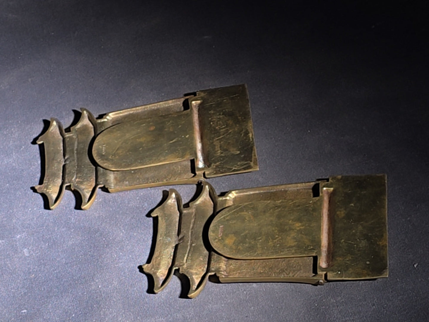 Grouping of Four Vintage Brass Pieces including Pair of Gilt Bodhisattva Head Busts on Stands and Pair of Korean Folding Bookends with Pagoda Gate Design