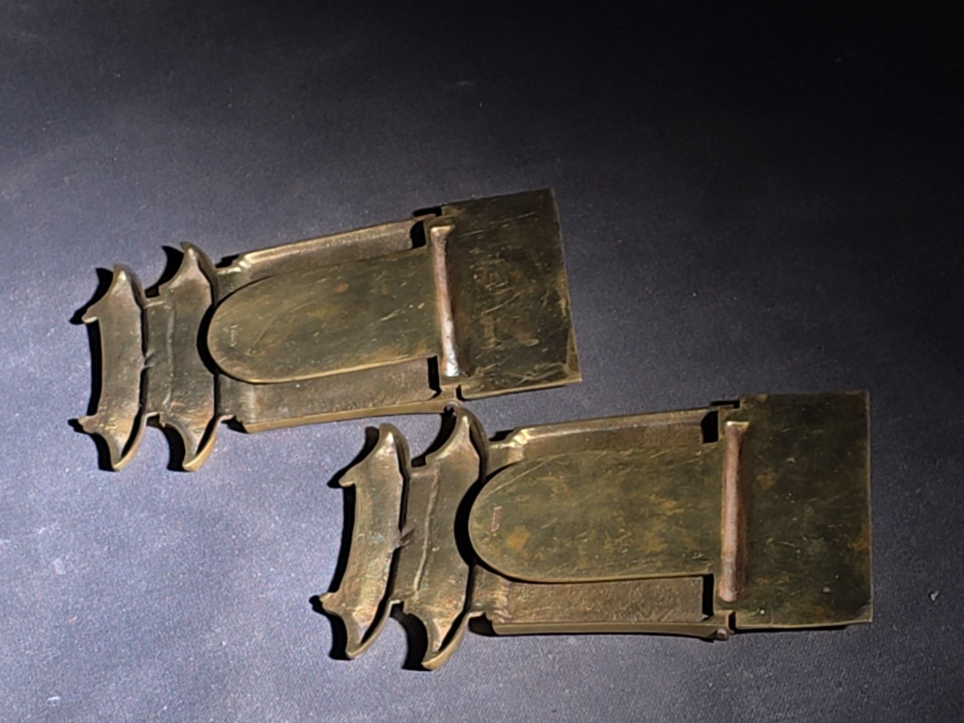 Grouping of Four Vintage Brass Pieces including Pair of Gilt Bodhisattva Head Busts on Stands and Pair of Korean Folding Bookends with Pagoda Gate Design