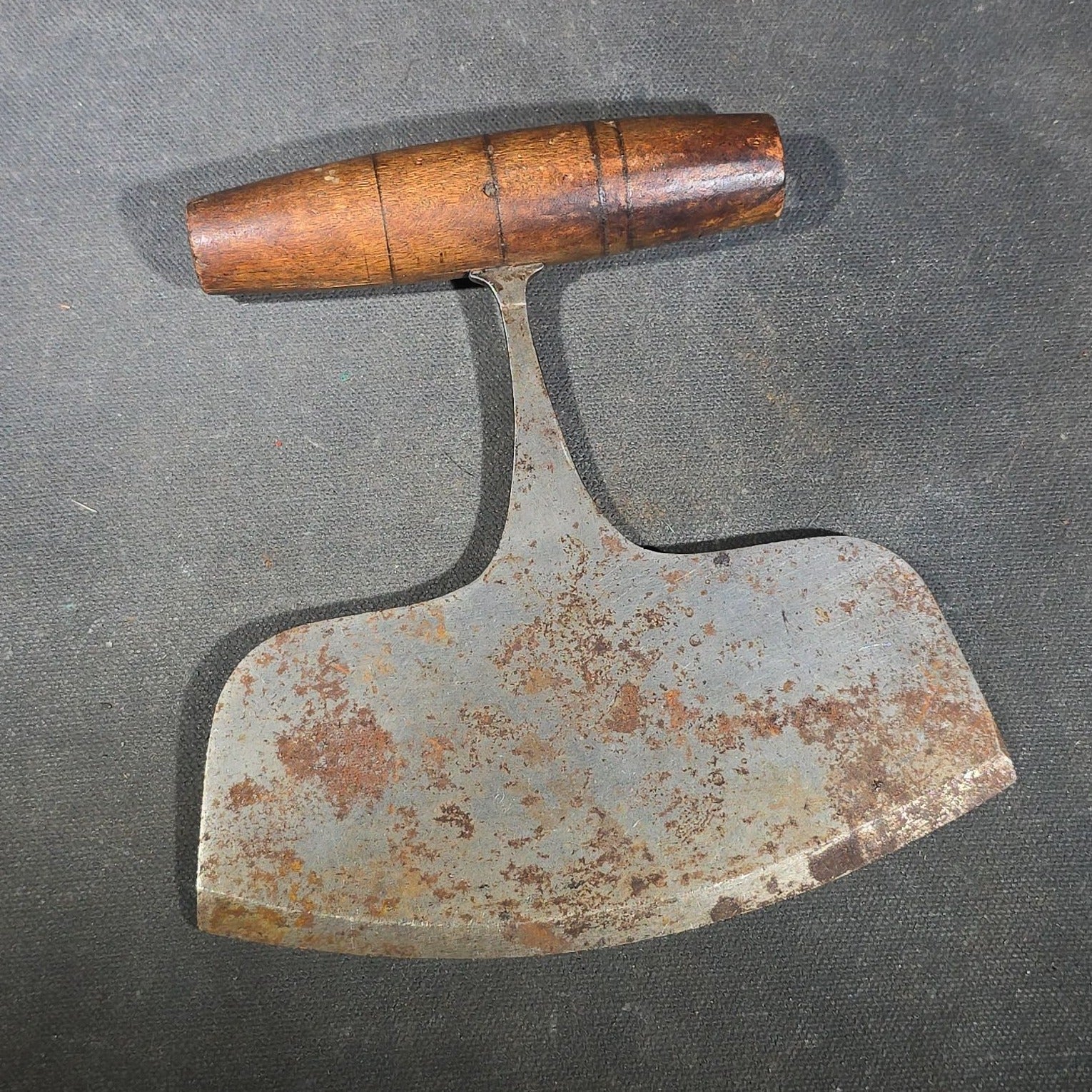 Grouping of Six Antique Iron Food Choppers with Wood Handles including One Stamped S. Jones