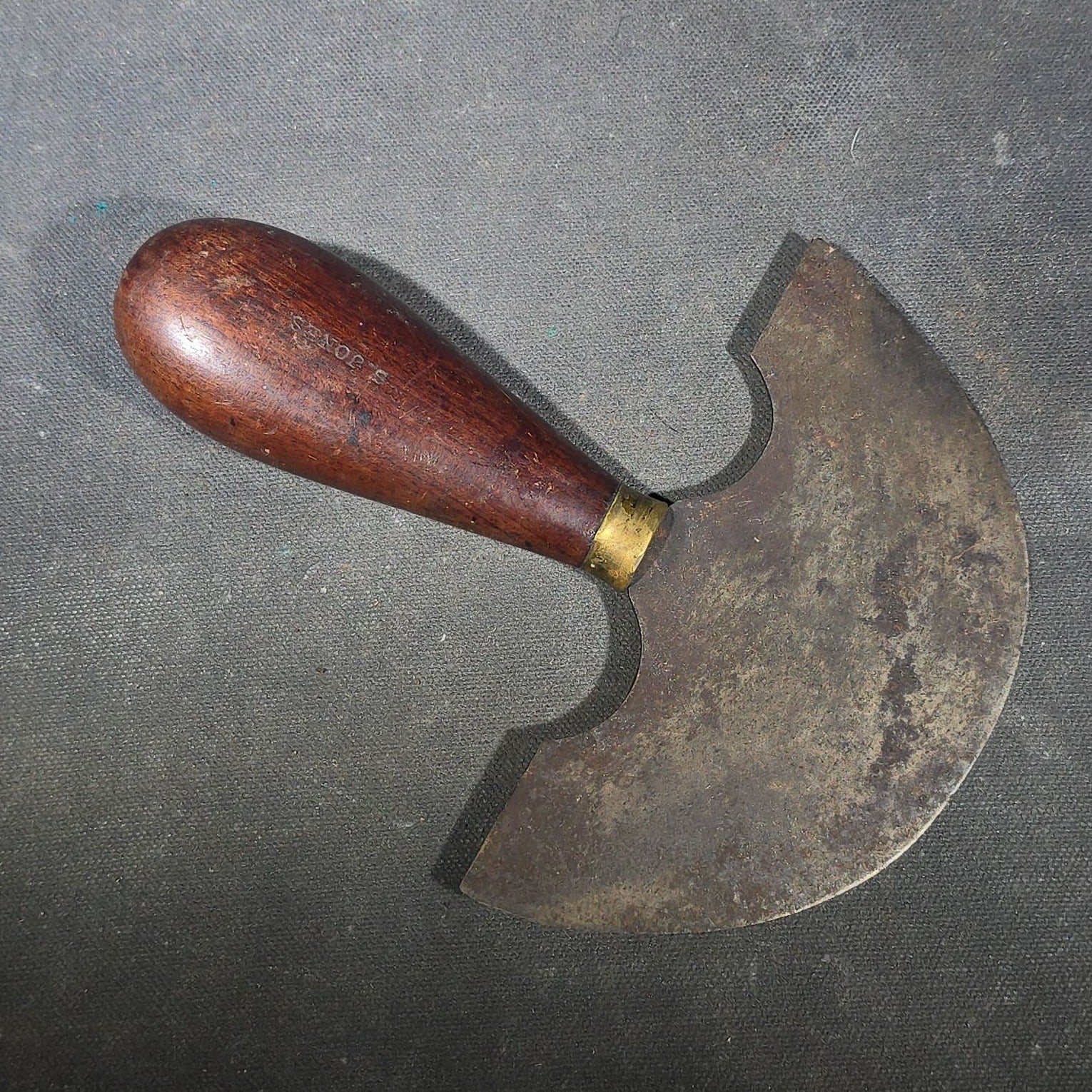 Grouping of Six Antique Iron Food Choppers with Wood Handles including One Stamped S. Jones