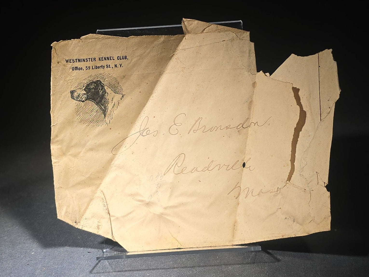 Grouping of Three Antique Westminster Kennel Club Dog Ephemera Pieces including 1895 Nineteenth Annual Bench Show Premium List with Spratts Patent Advertising, Illustrated Mailing Envelope, and Board-Mounted Photograph of a Child with a Dog