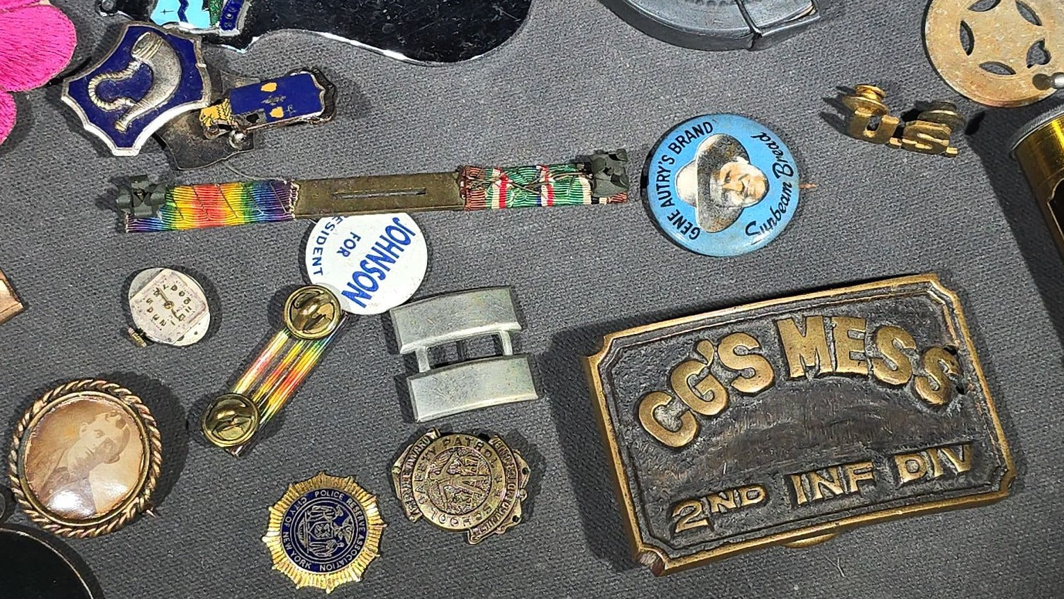 Grouping of Antique and Vintage Junk Drawer Smalls including Eagle Pencil Co. Compass Box, Ford Key Fob, Military Medals and Belt Buckle, Eyeglasses, Match Safe, and Pinback Buttons