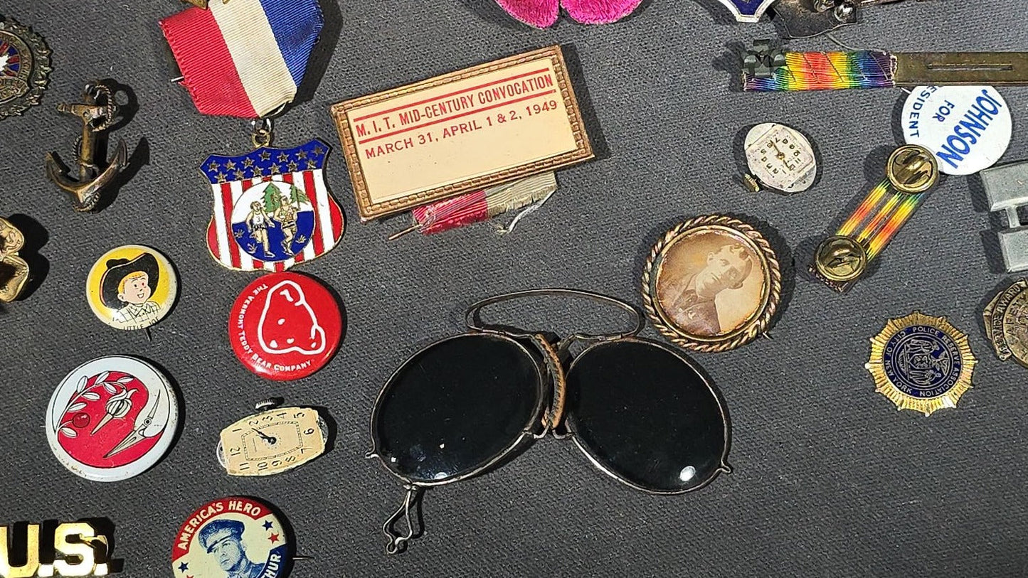Grouping of Antique and Vintage Junk Drawer Smalls including Eagle Pencil Co. Compass Box, Ford Key Fob, Military Medals and Belt Buckle, Eyeglasses, Match Safe, and Pinback Buttons