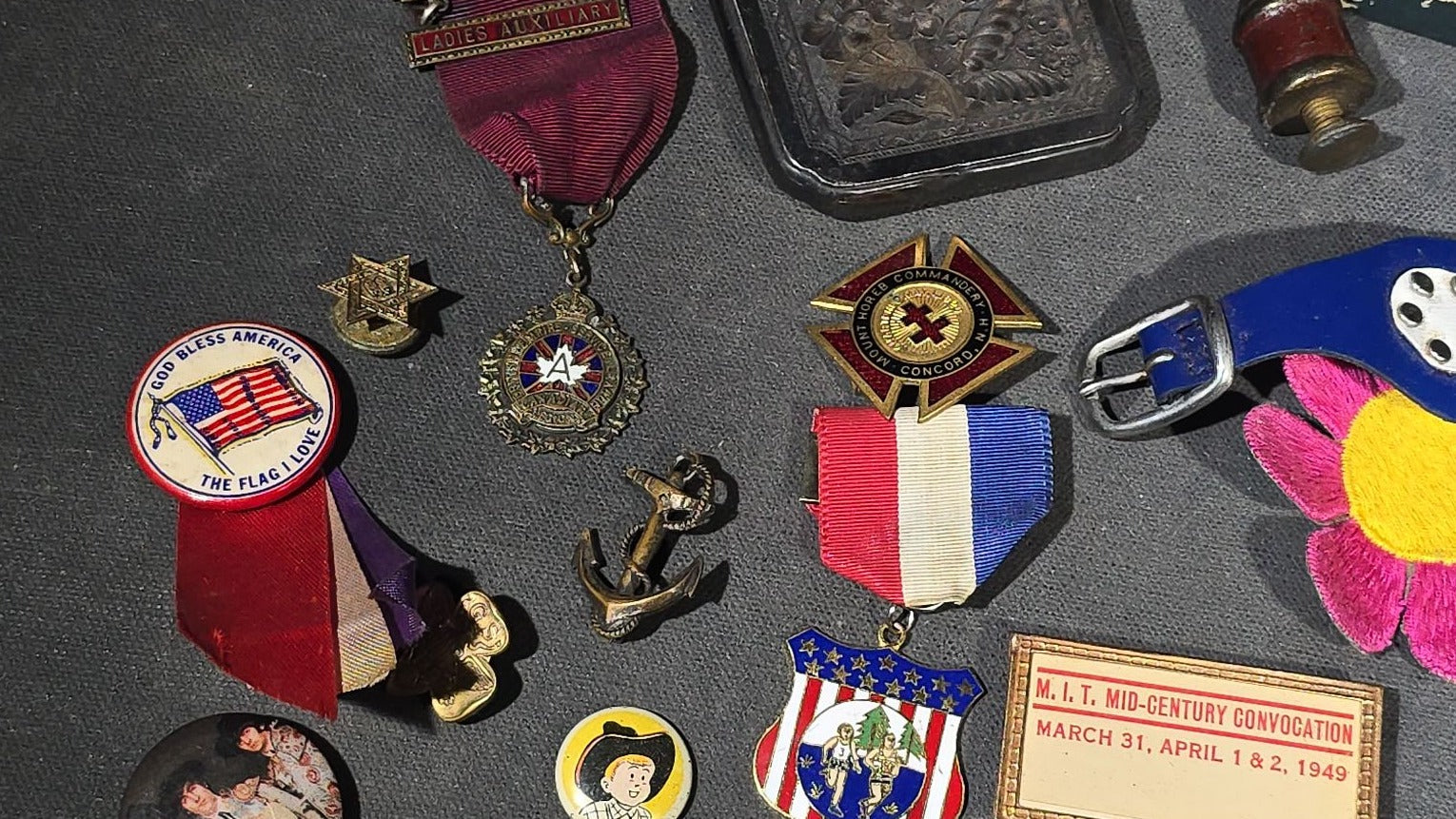 Grouping of Antique and Vintage Junk Drawer Smalls including Eagle Pencil Co. Compass Box, Ford Key Fob, Military Medals and Belt Buckle, Eyeglasses, Match Safe, and Pinback Buttons