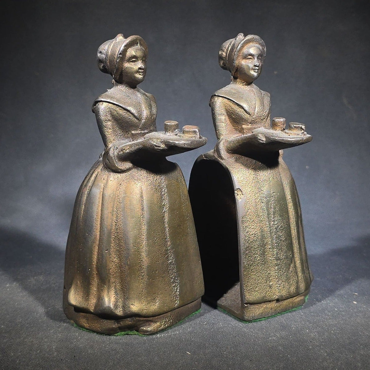 Pair of Antique Cast Iron Advertising Bookends and "Choice Recipes" Booklet, Walter Baker & Co. Ltd., Dorchester, Massachusetts, "La Belle Chocolatiere" Chocolate Maid Figure