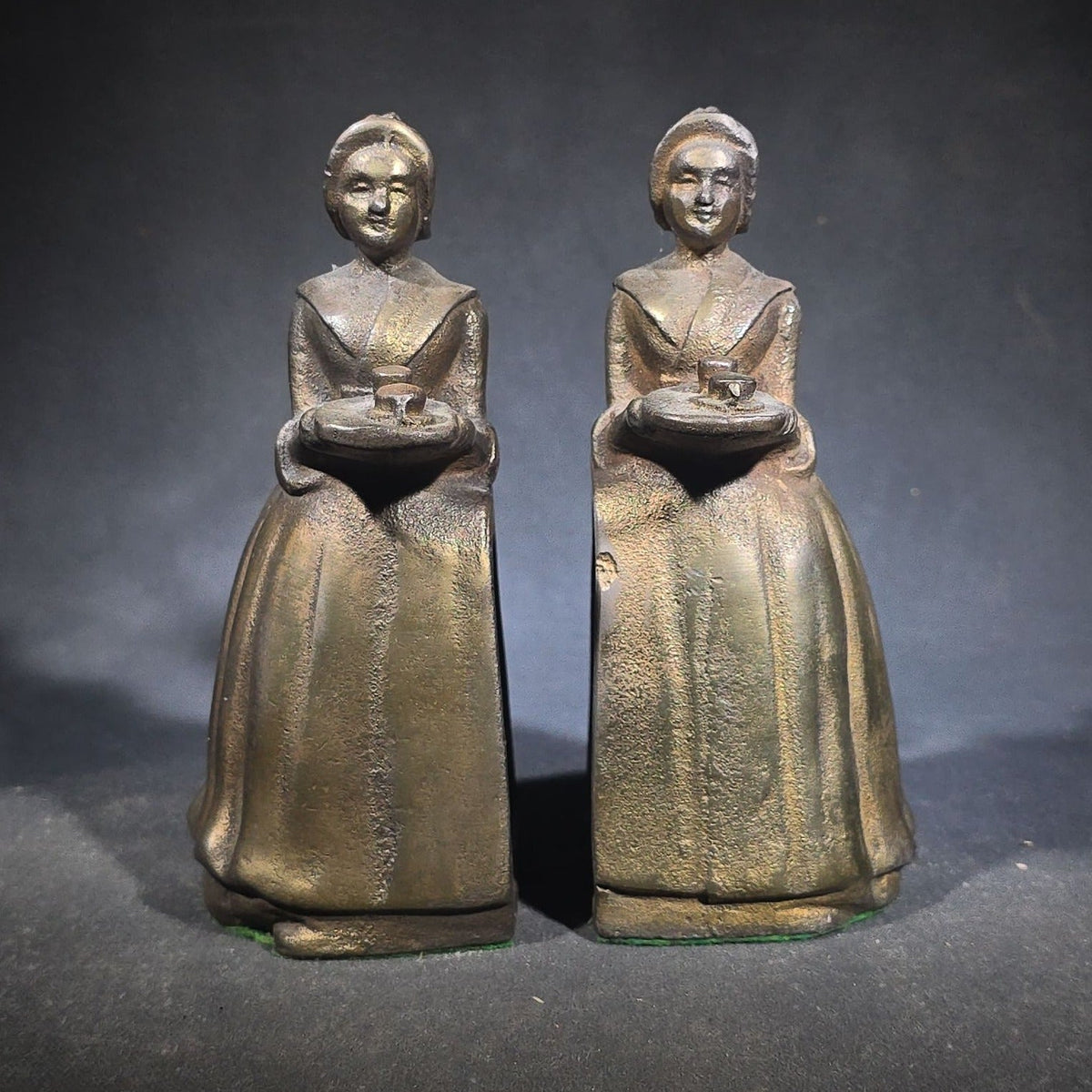 Pair of Antique Cast Iron Advertising Bookends and "Choice Recipes" Booklet, Walter Baker & Co. Ltd., Dorchester, Massachusetts, "La Belle Chocolatiere" Chocolate Maid Figure