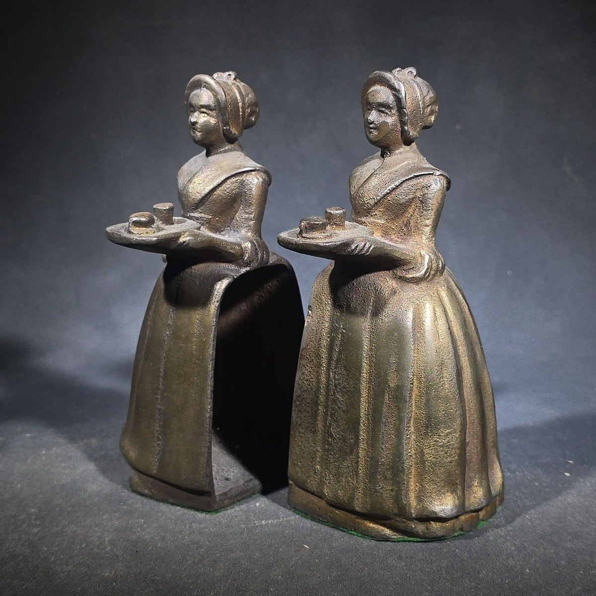 Pair of Antique Cast Iron Advertising Bookends and "Choice Recipes" Booklet, Walter Baker & Co. Ltd., Dorchester, Massachusetts, "La Belle Chocolatiere" Chocolate Maid Figure