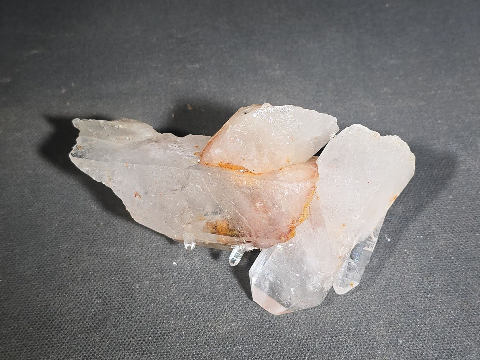 Grouping of Five Mineral Specimens Including Four Quartz Crystal Points and Blue Kyanite in Matrix