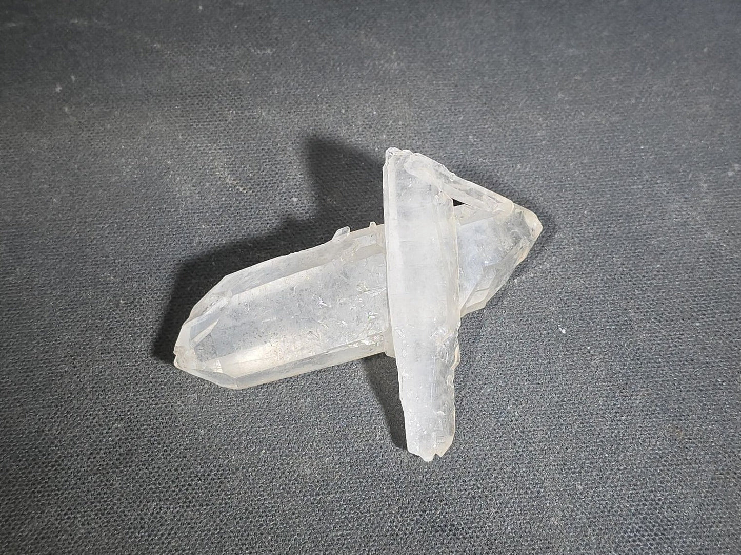 Grouping of Five Mineral Specimens Including Four Quartz Crystal Points and Blue Kyanite in Matrix