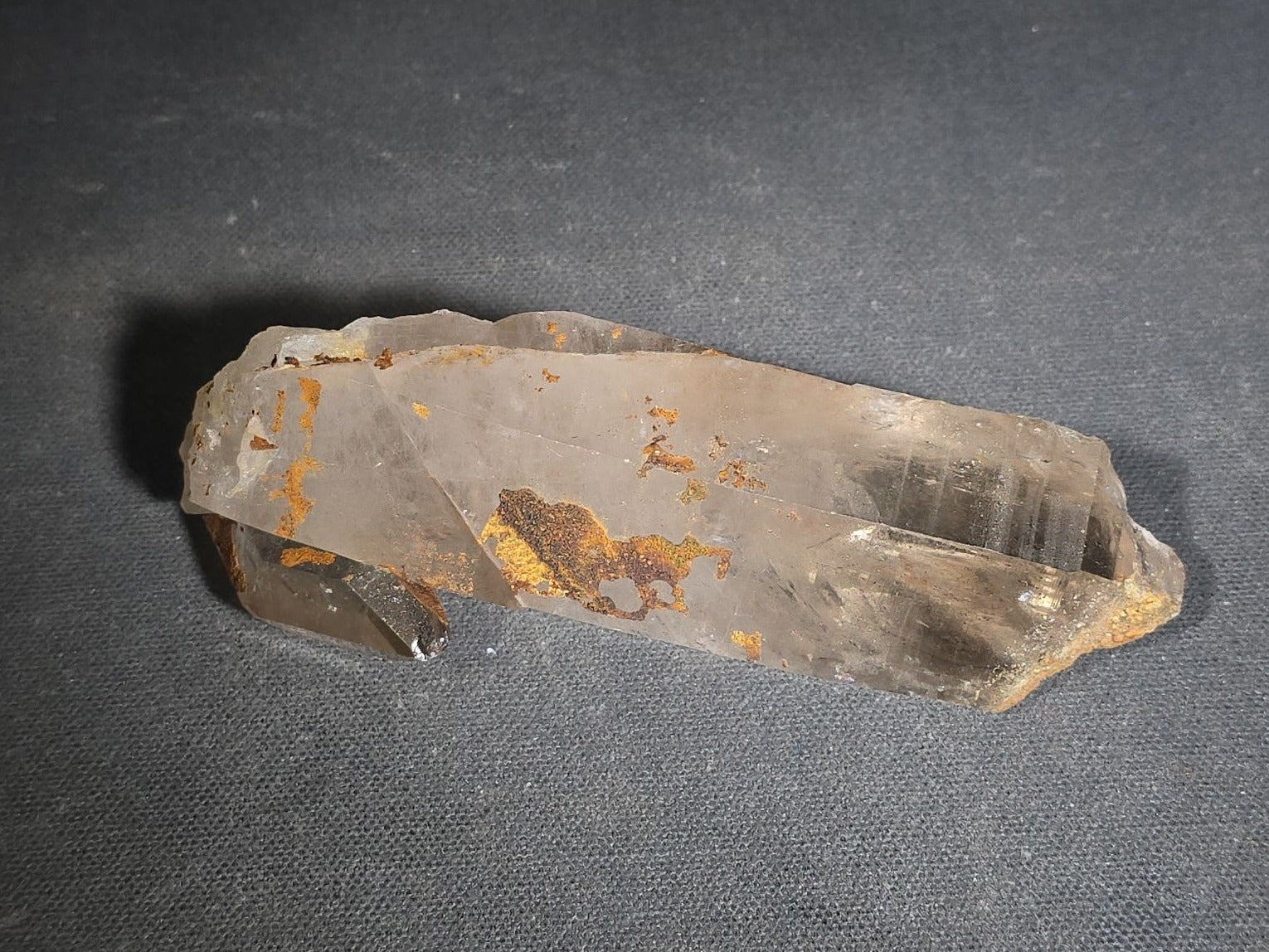 Grouping of Five Mineral Specimens Including Four Quartz Crystal Points and Blue Kyanite in Matrix