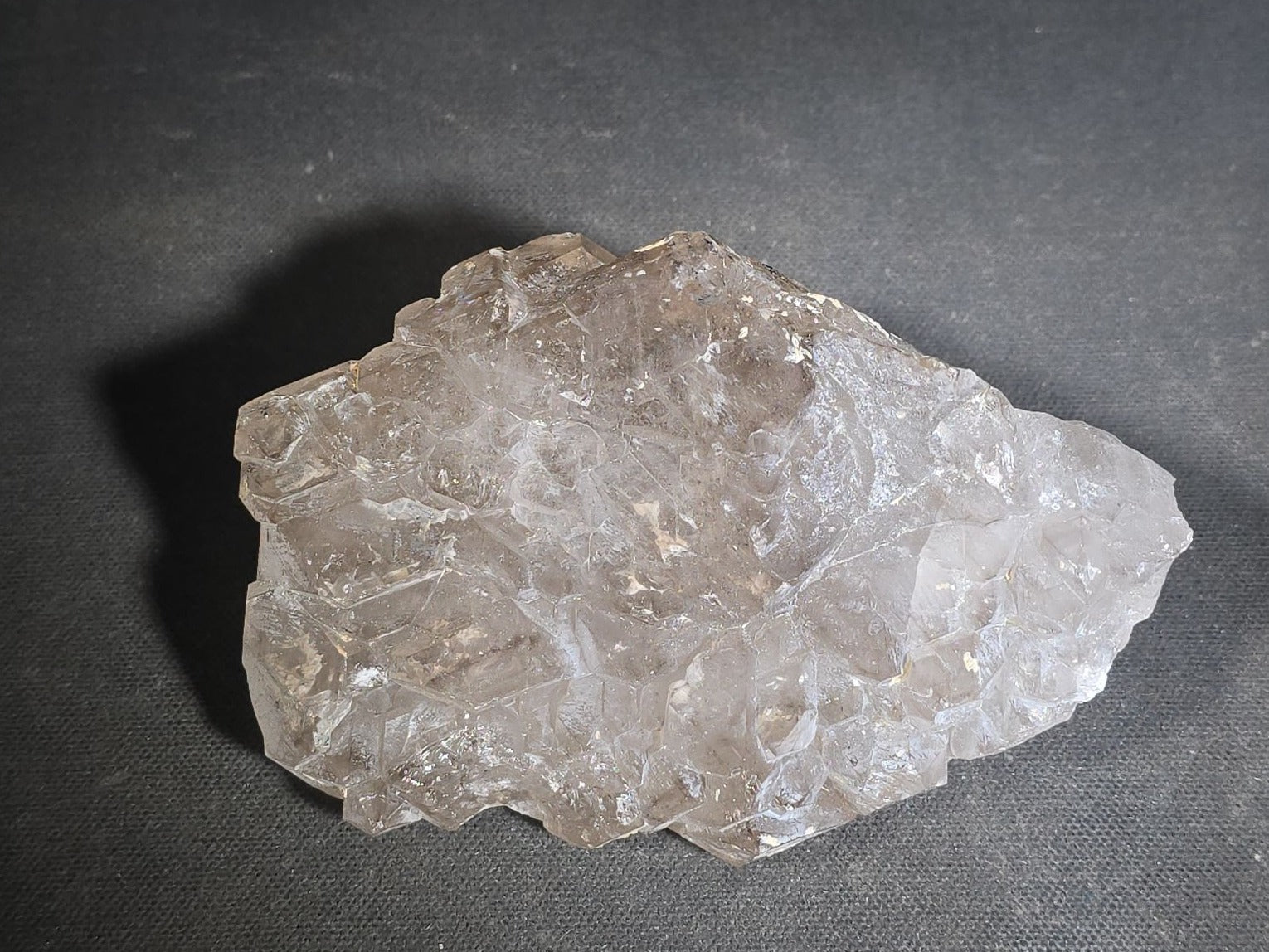 Grouping of Five Mineral Specimens Including Four Quartz Crystal Points and Blue Kyanite in Matrix