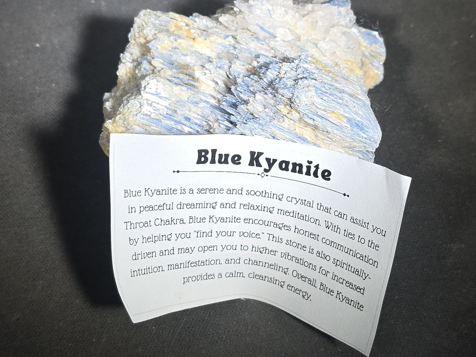 Grouping of Five Mineral Specimens Including Four Quartz Crystal Points and Blue Kyanite in Matrix