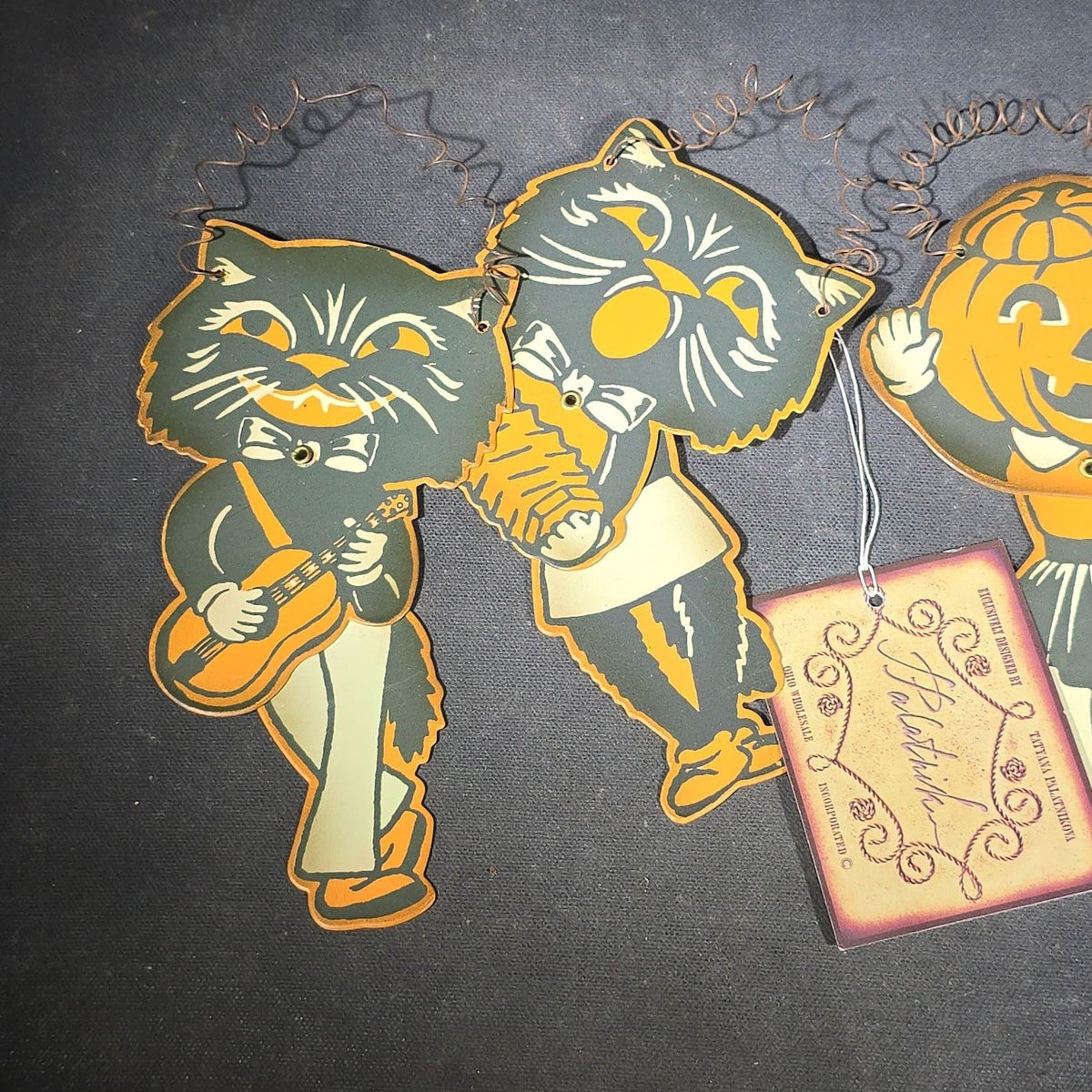 Grouping of Seven Modern Halloween Items including Six Retro-Style Jointed Metal Black Cat and Jack-O-Lantern Figures, Designed by Tatyana Palatnikova for Ohio Wholesale Inc., and "A Joyful Halloween" Reproduction Print