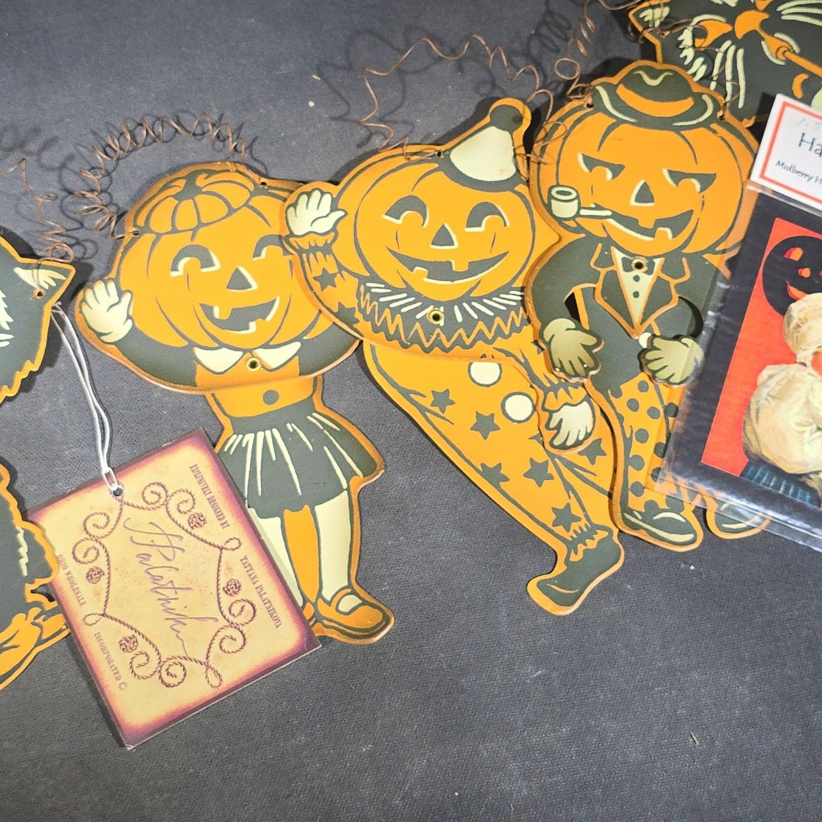 Grouping of Seven Modern Halloween Items including Six Retro-Style Jointed Metal Black Cat and Jack-O-Lantern Figures, Designed by Tatyana Palatnikova for Ohio Wholesale Inc., and "A Joyful Halloween" Reproduction Print