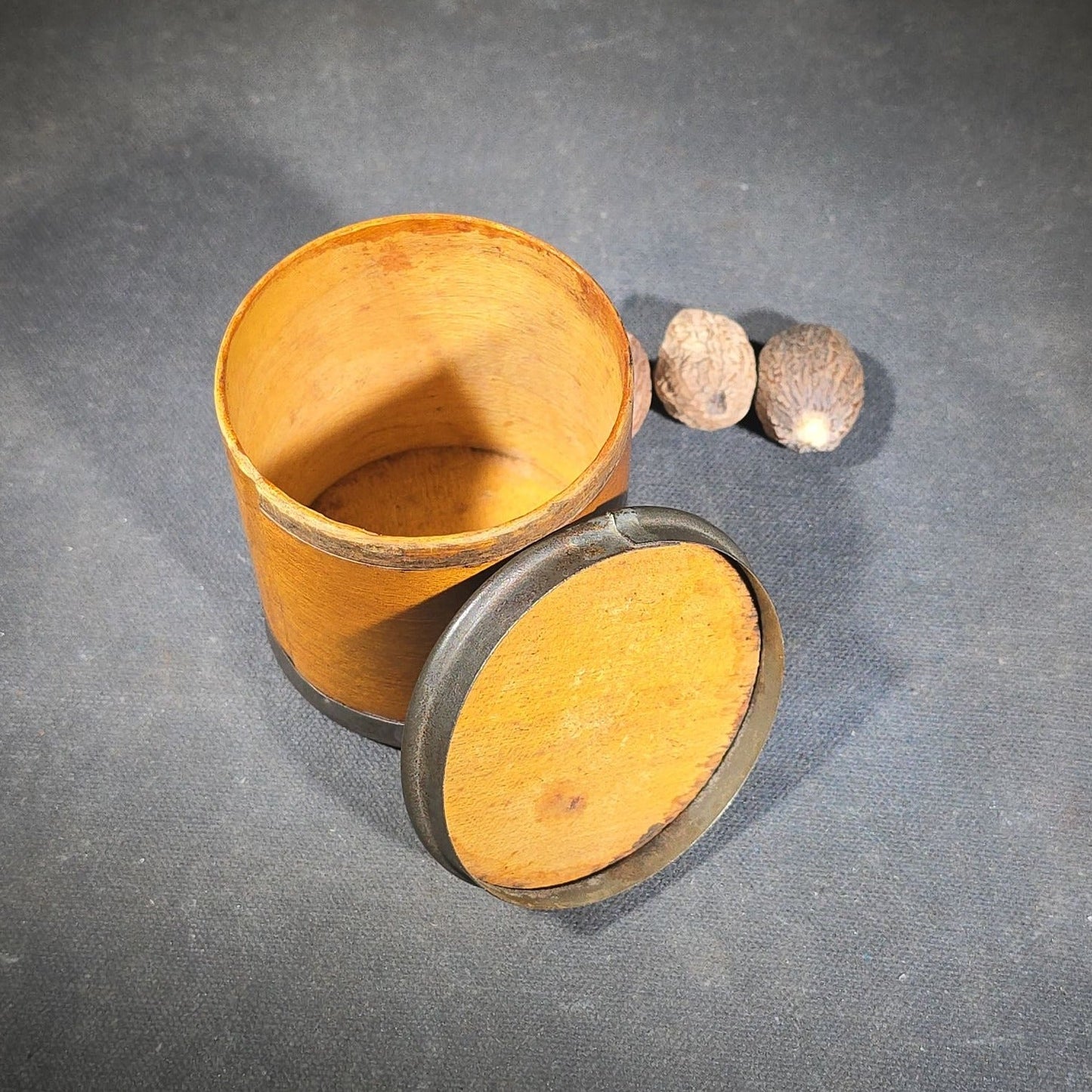 Antique Stenciled Wooden Nutmeg Canister with Metal Bands and Lid, Containing Four Whole Nutmegs