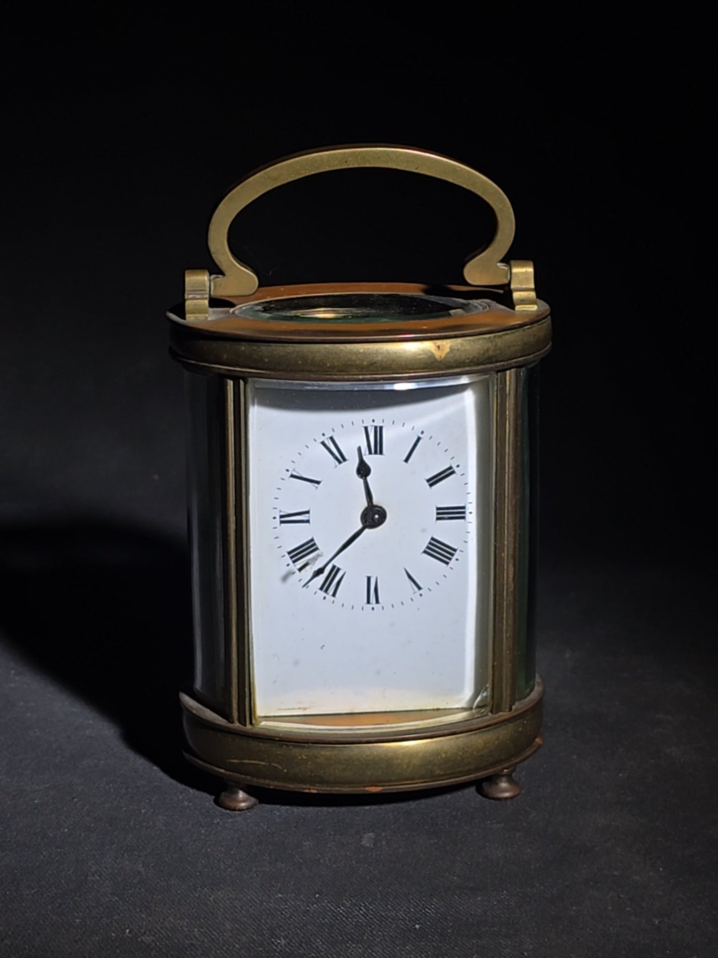 Antique French Brass Oval Carriage Clock with Five Beveled Glass Panels and Roman Numeral Dial, France, Chipped