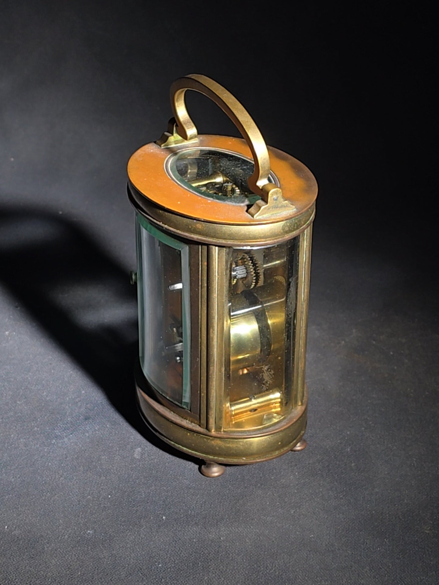 Antique French Brass Oval Carriage Clock with Five Beveled Glass Panels and Roman Numeral Dial, France, Chipped