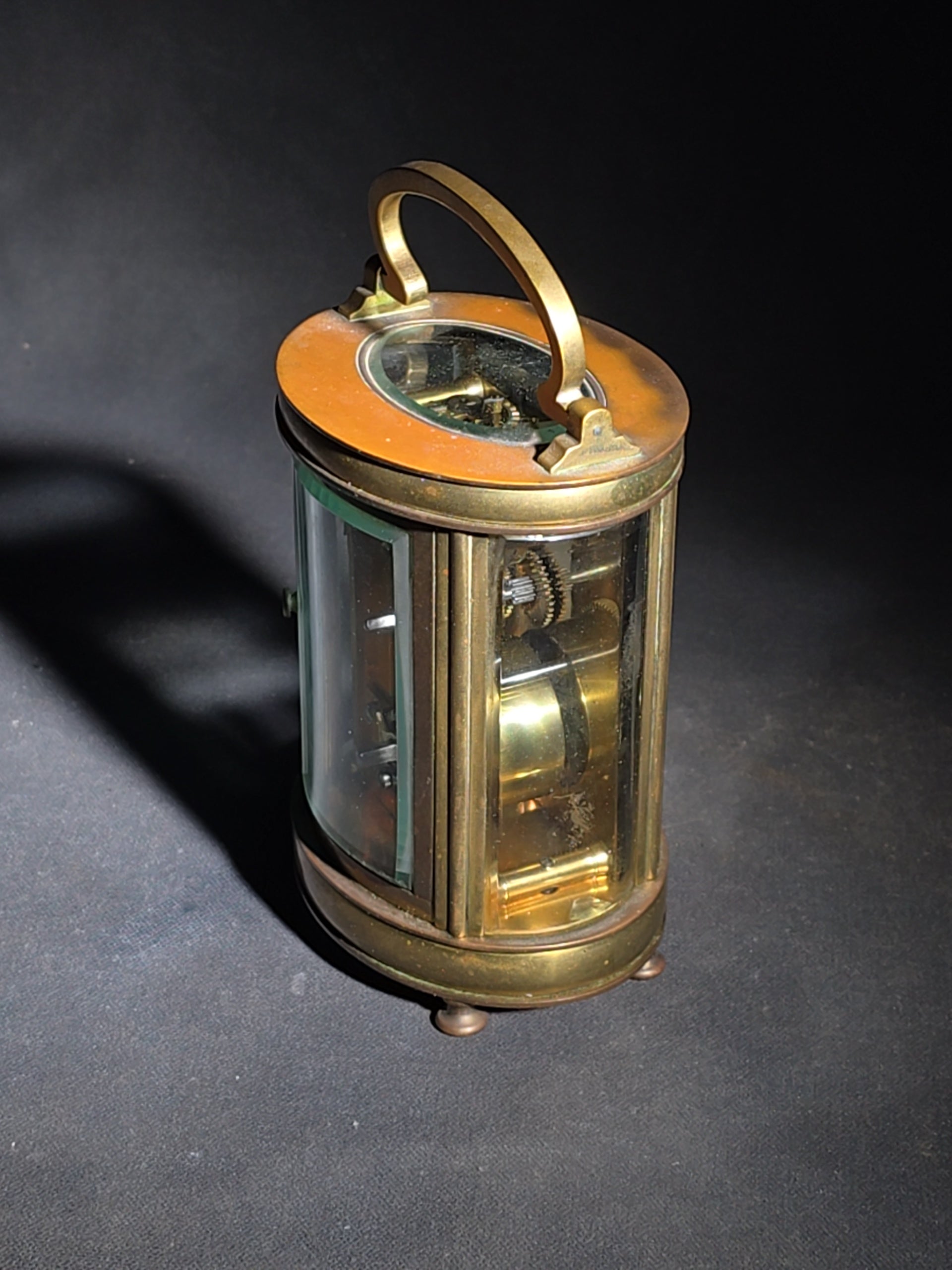 Antique French Brass Oval Carriage Clock with Five Beveled Glass Panels and Roman Numeral Dial, France, Chipped