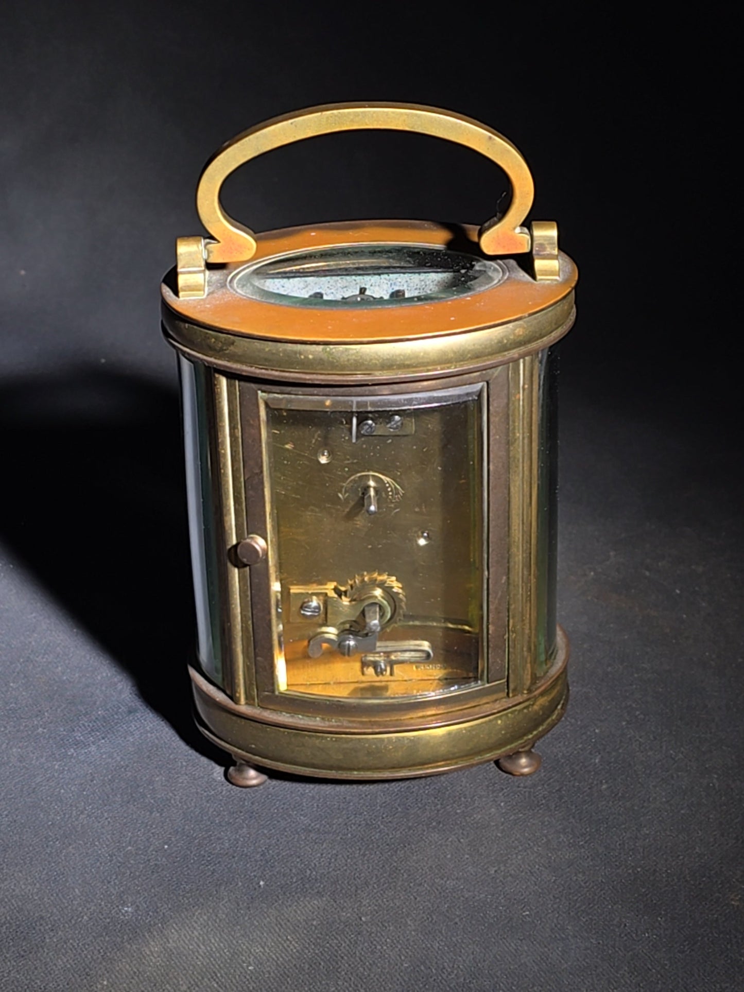 Antique French Brass Oval Carriage Clock with Five Beveled Glass Panels and Roman Numeral Dial, France, Chipped