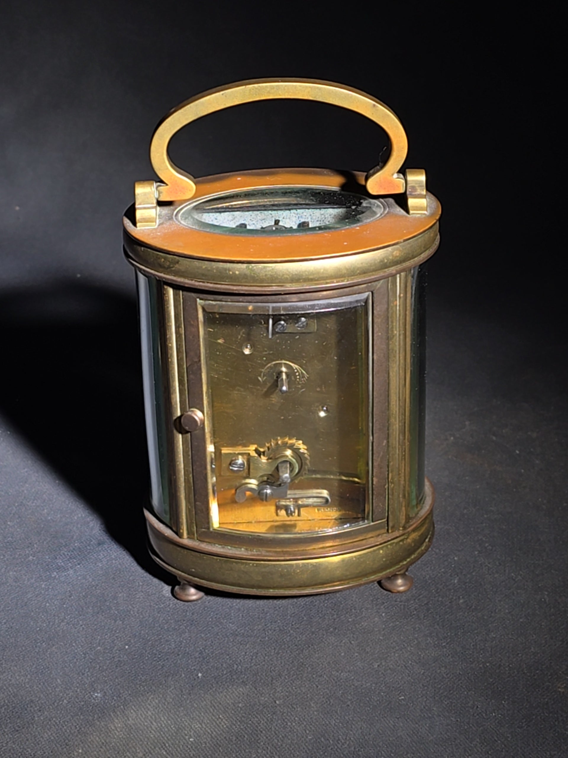 Antique French Brass Oval Carriage Clock with Five Beveled Glass Panels and Roman Numeral Dial, France, Chipped