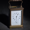 Lot 108 - Antique Tiffany & Co. Brass Carriage Clock with Alarm, Beveled Glass Panels, and Roman Numeral Dial, New York, Chipped, 7" H
