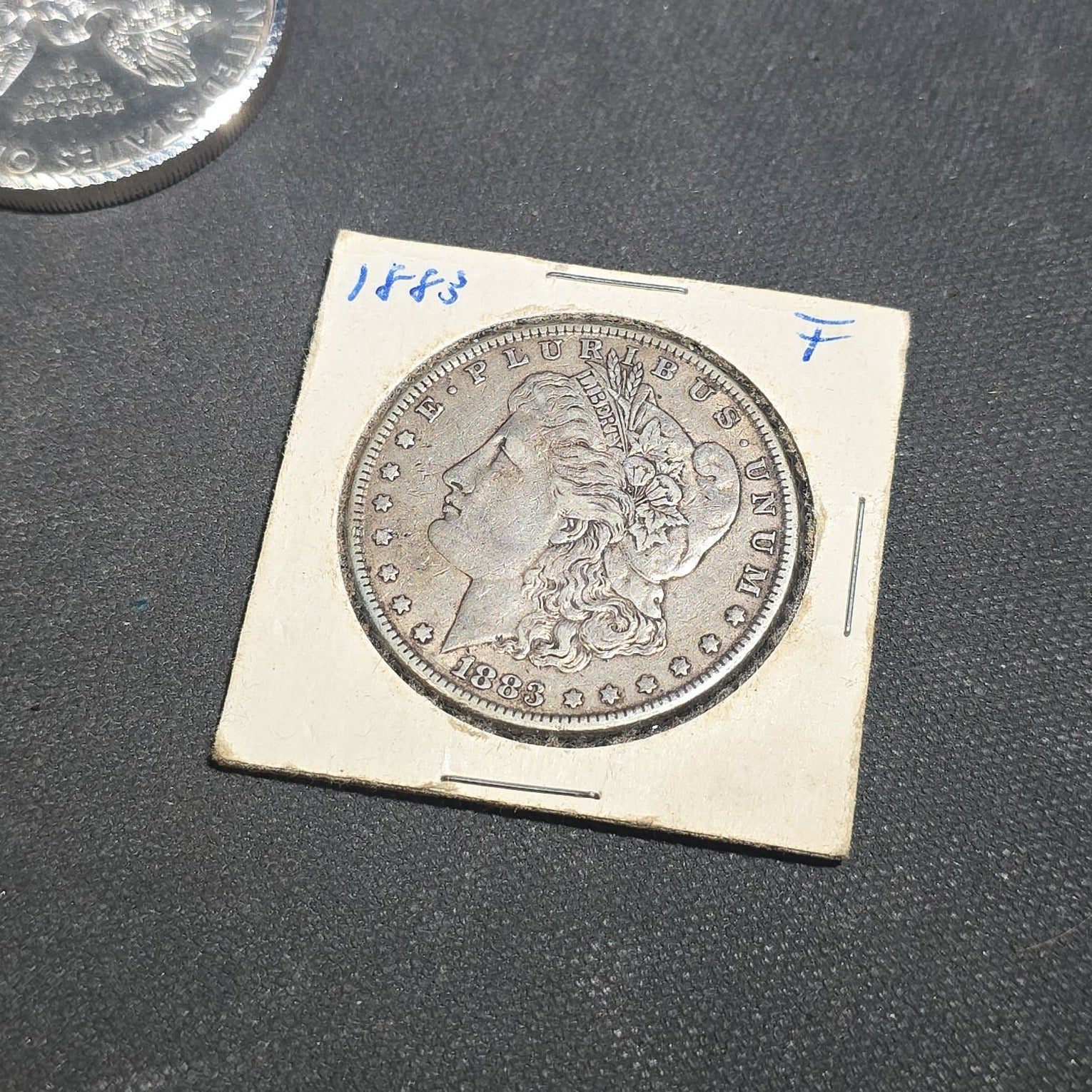 Grouping of Antique and Reproduction Coins, Coin Pendants, Bead Necklaces, and Carved Pendant including 1883 Morgan Dollar and Seated Liberty Coin Jewelry