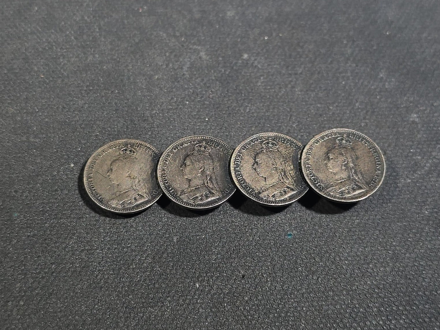 Grouping of Antique and Reproduction Coins, Coin Pendants, Bead Necklaces, and Carved Pendant including 1883 Morgan Dollar and Seated Liberty Coin Jewelry