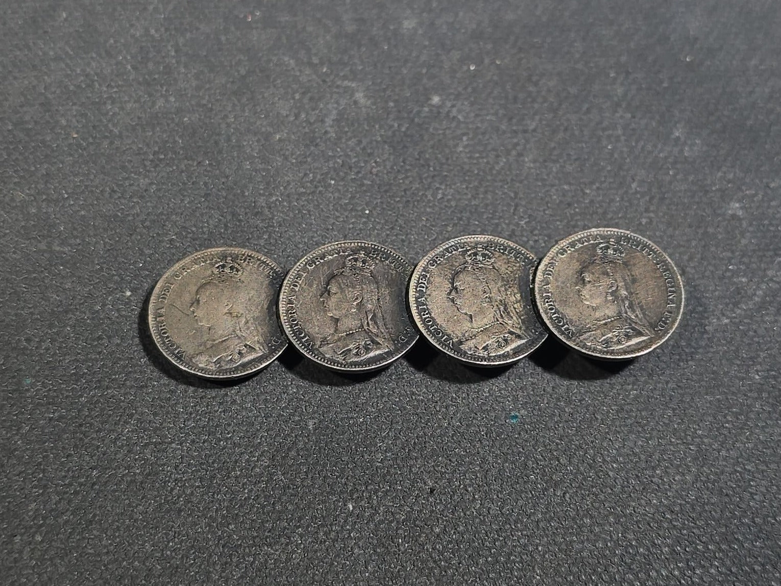 Grouping of Antique and Reproduction Coins, Coin Pendants, Bead Necklaces, and Carved Pendant including 1883 Morgan Dollar and Seated Liberty Coin Jewelry