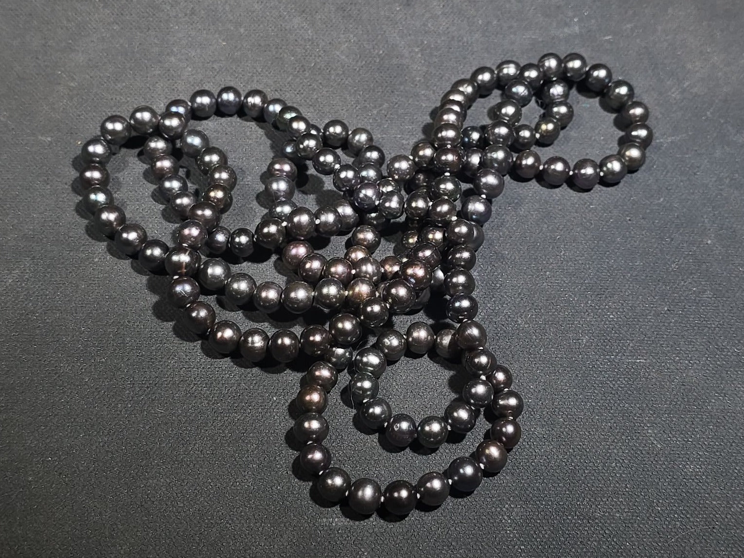 Grouping of Antique and Reproduction Coins, Coin Pendants, Bead Necklaces, and Carved Pendant including 1883 Morgan Dollar and Seated Liberty Coin Jewelry