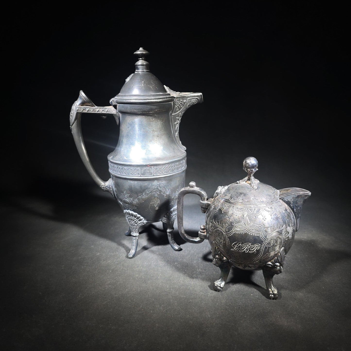Pair of Antique Silverplate Serving Pieces including Reed & Barton Footed Coffeepot No. 2930 and Monogrammed Spherical Teapot with Lion Mask and Paw Feet