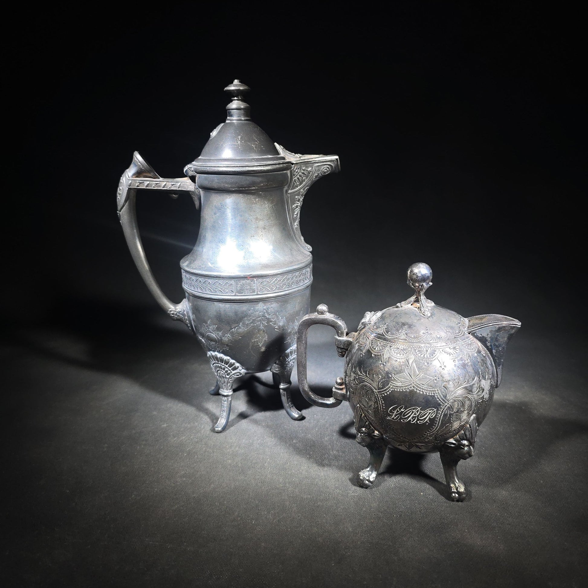 Pair of Antique Silverplate Serving Pieces including Reed & Barton Footed Coffeepot No. 2930 and Monogrammed Spherical Teapot with Lion Mask and Paw Feet