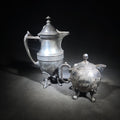 Lot 092 - Pair of Antique Silverplate Serving Pieces Including Reed & Barton Footed Coffeepot No. 2930 and Monogrammed Spherical Teapot with Lion Mask and Paw Feet
