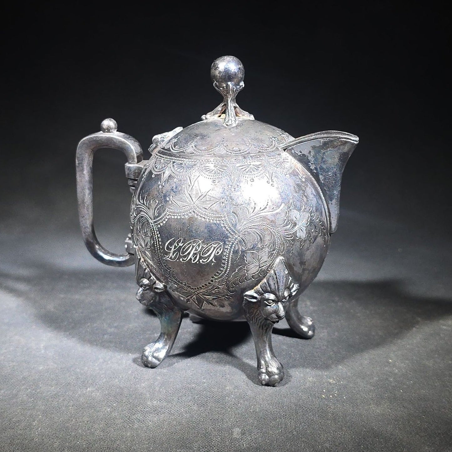 Pair of Antique Silverplate Serving Pieces including Reed & Barton Footed Coffeepot No. 2930 and Monogrammed Spherical Teapot with Lion Mask and Paw Feet